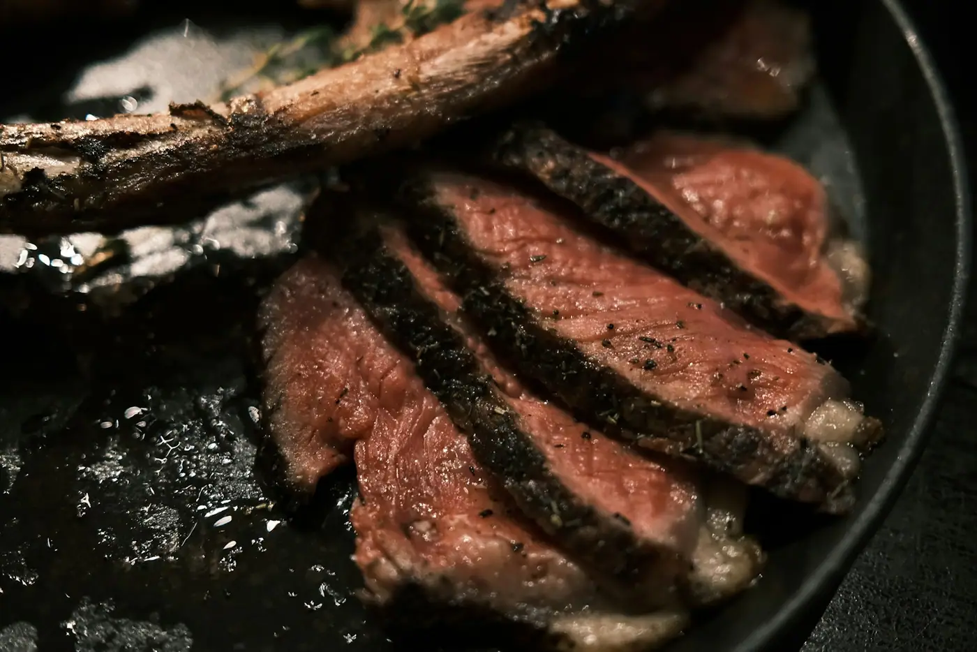 Sliced steak in a cast-iron pan (placeholder photograph)